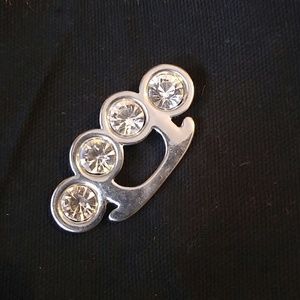 Brass knuckle charm