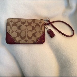 Authentic Coach wristlet with red patent trim