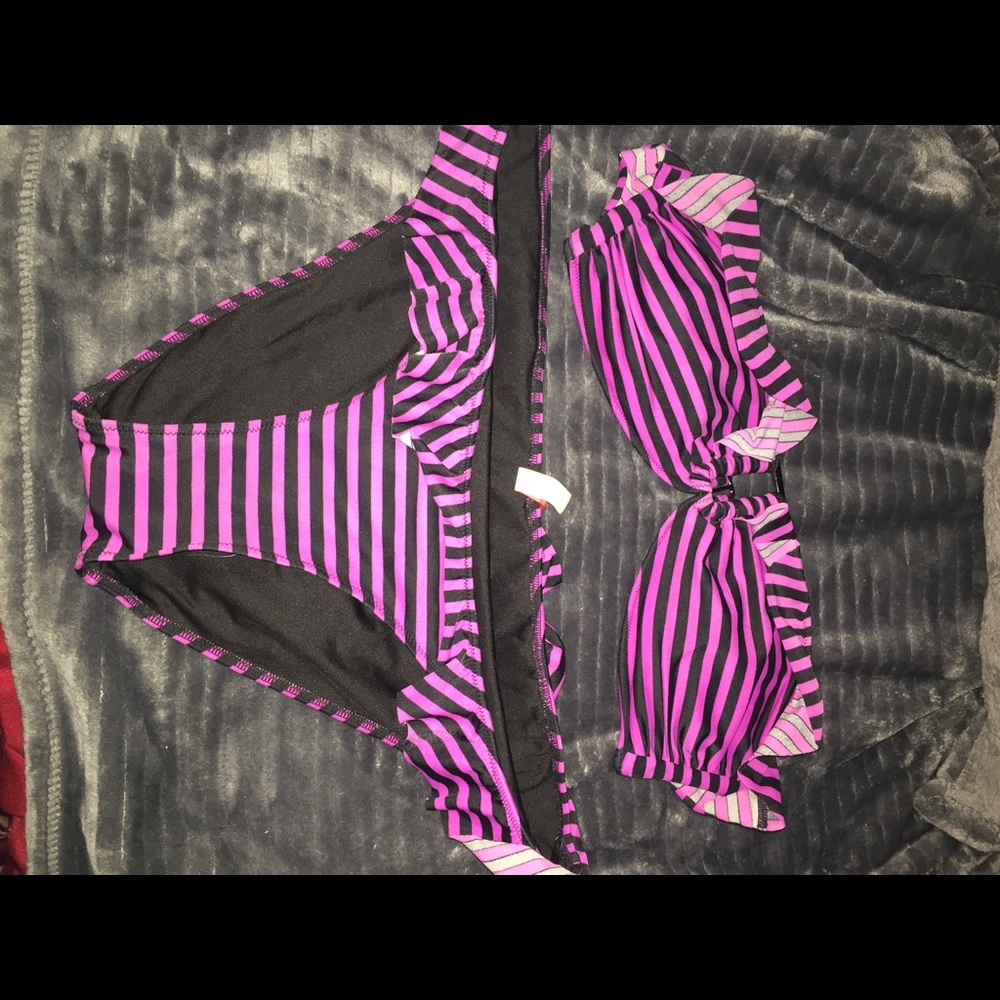 Black and purple strapless bathing suit.