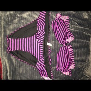 Black and purple strapless bathing suit.