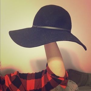 Black, floppy style hat. 100% wool