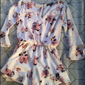 Floral romper with deep v neck and flowy shorts