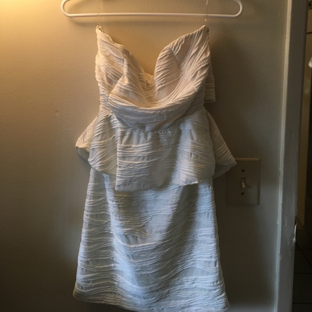 Cream strapless peplum dress