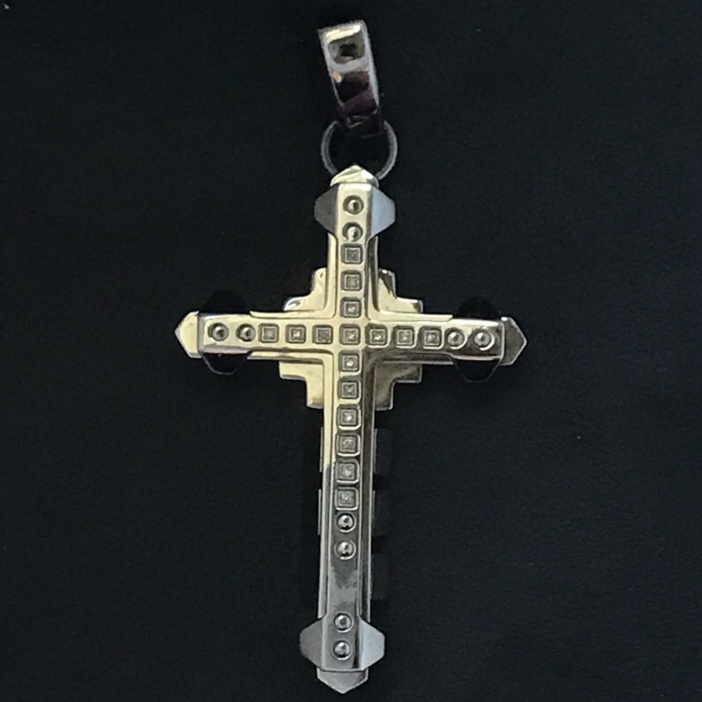 A STAINLESS STEEL AND DIAMOND CROSS