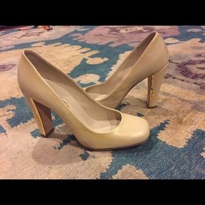 $795 Chanel Gold Logo Pumps