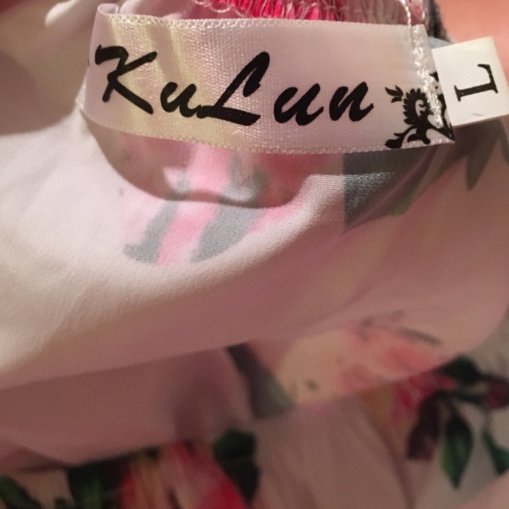 Photo of tag for floral off shoulder romper