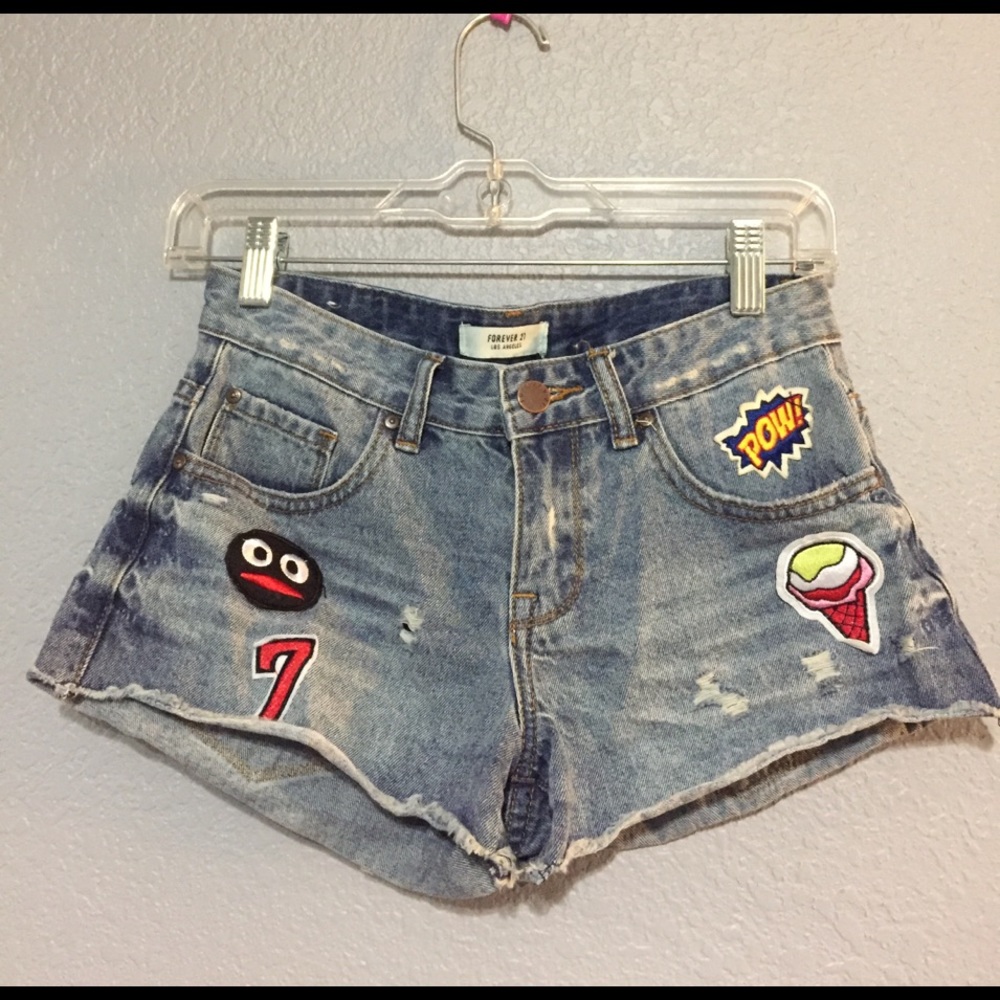 Patched and distressed denim shorts