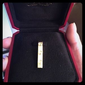 Authentic Cartier 18kt yellow gold Love pendant.