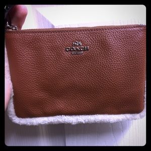 Brand new leather wristlet with faux fur trim