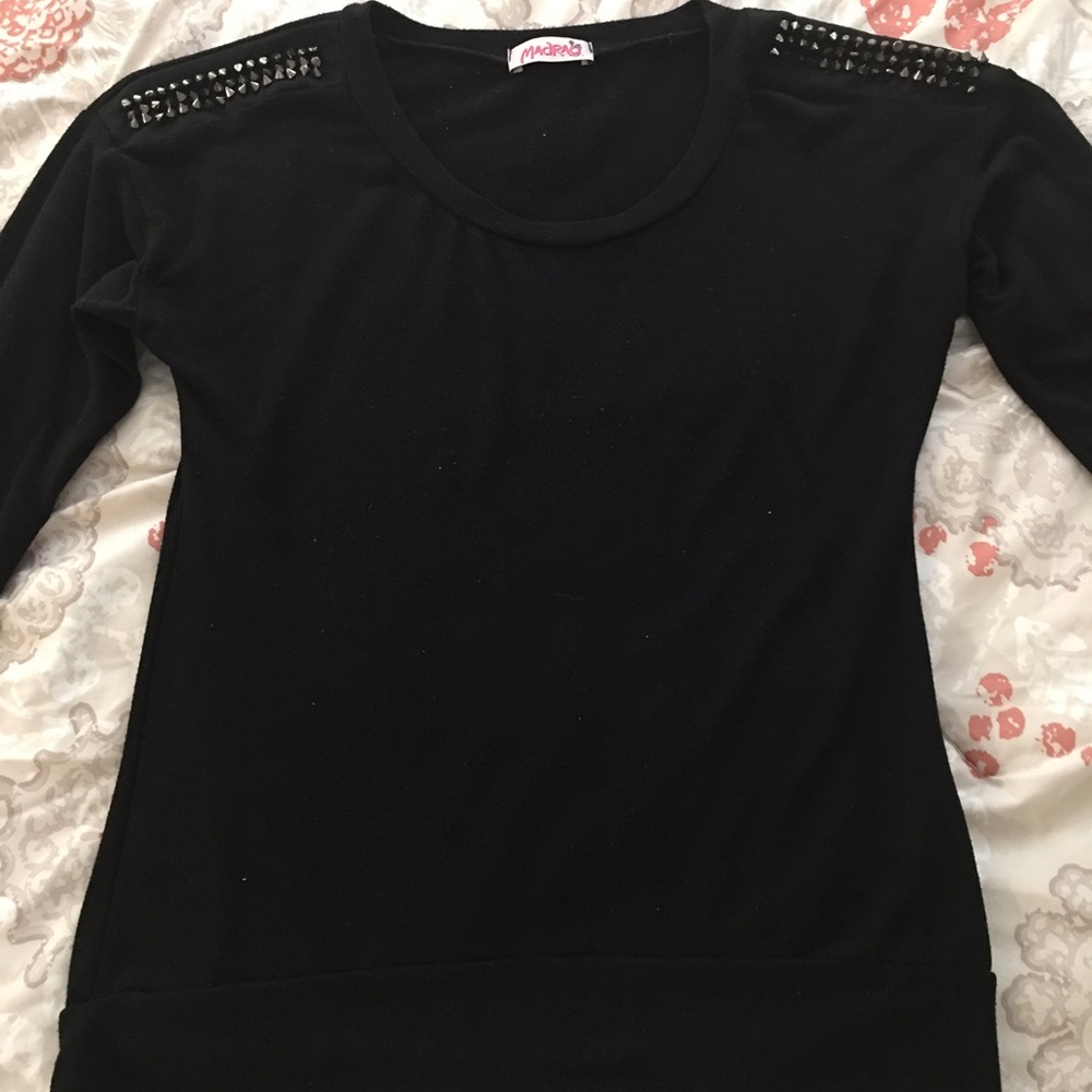 Studded shoulder pullover sweater.