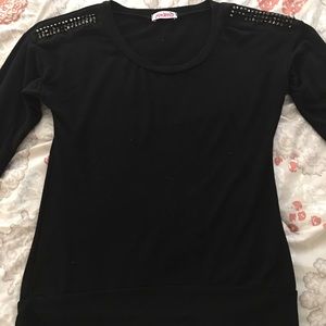 Studded shoulder pullover sweater.