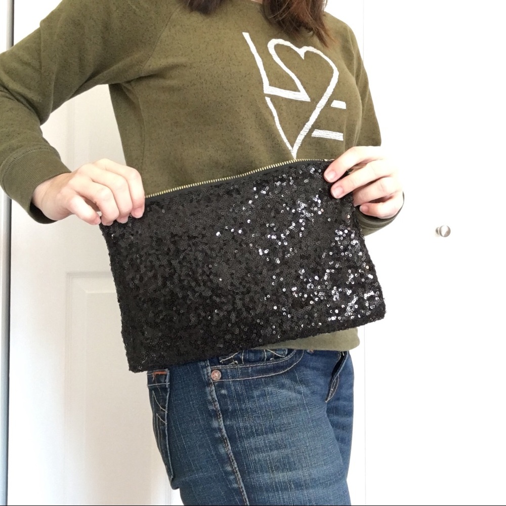 Black sequin zip clutch with leopard lining!