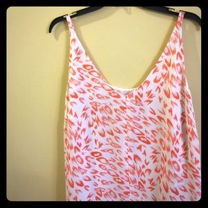 100% polyester layered dress up/dress down tank.