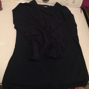 3/4 sleeve v neck blouse with roll tab sleeves.