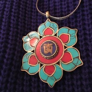 Turquoise and coral inlaid Om pendant. Silver tone