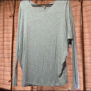 Grey long sleeve bat sleeve shirt.