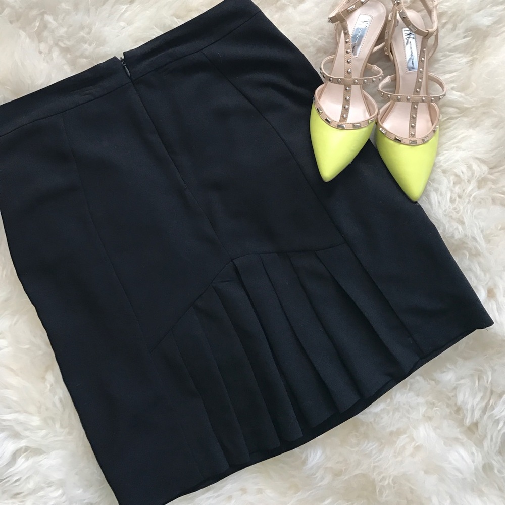 Pleated black pencil skirt