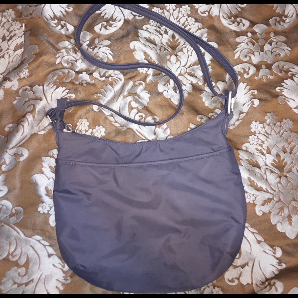 Travelon Crossbody with hot pink interior.