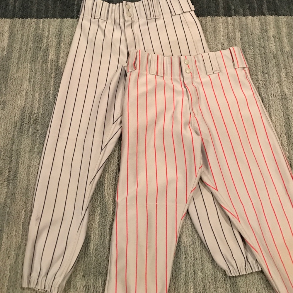 Two pairs of pin striped baseball pants