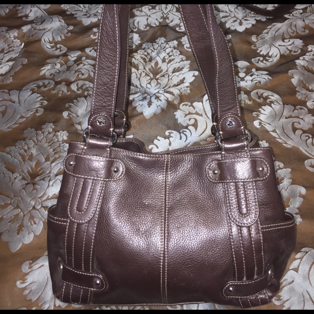 Tignanello Handbag with gold chain interior.