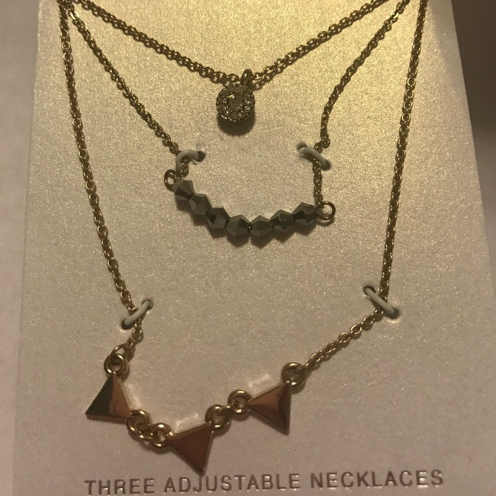 Three Gold Adjustable Necklaces.