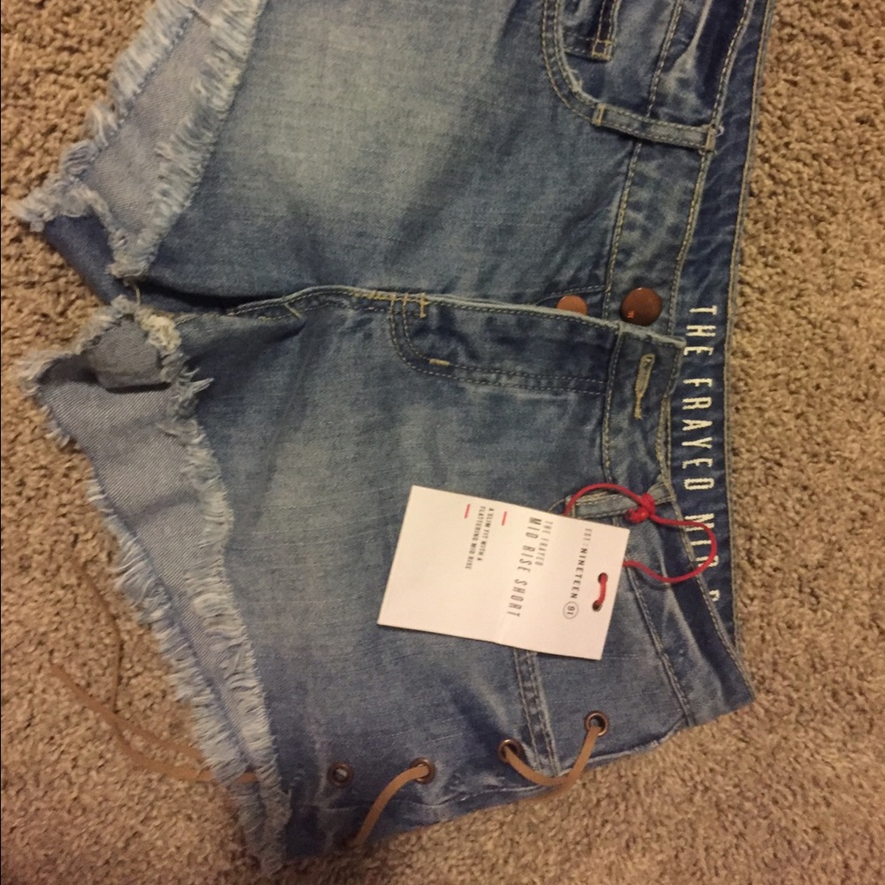 Brand new, frayed, lace-up, mid-rise jean shorts!