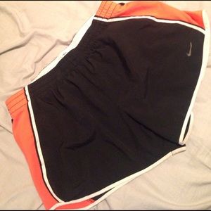 Black and orange Nike running shorts
