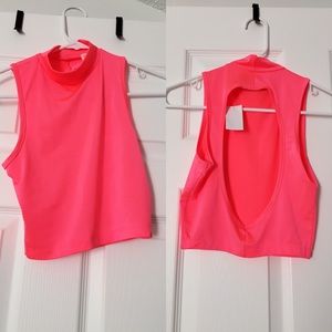 Neon pink crop top.