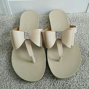 Tan flip flops