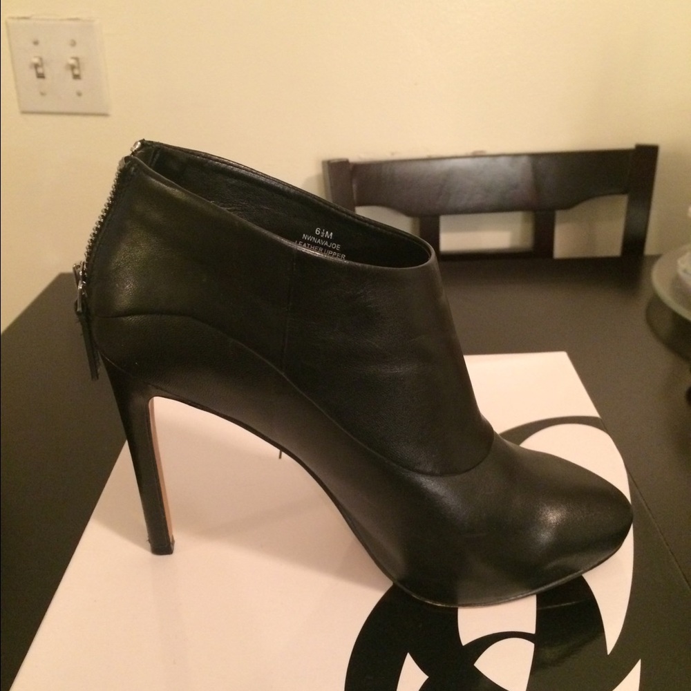 Black patent leather booties. Firm price.