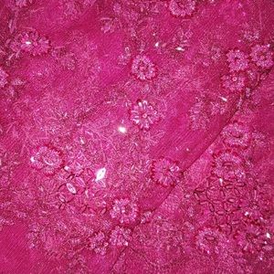 Fushia pink African lace fabric-held