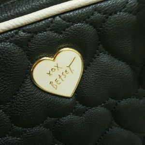 NWOT. Black and white with gold hardware backpack