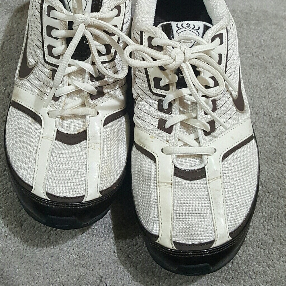 White and Brown Nike tennis shoes