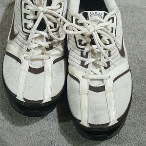 White and Brown Nike tennis shoes