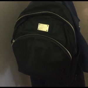 Michael Kors black backpack with gold plate