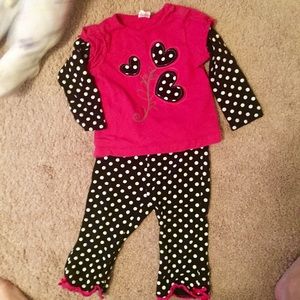 Pink and black outfit.