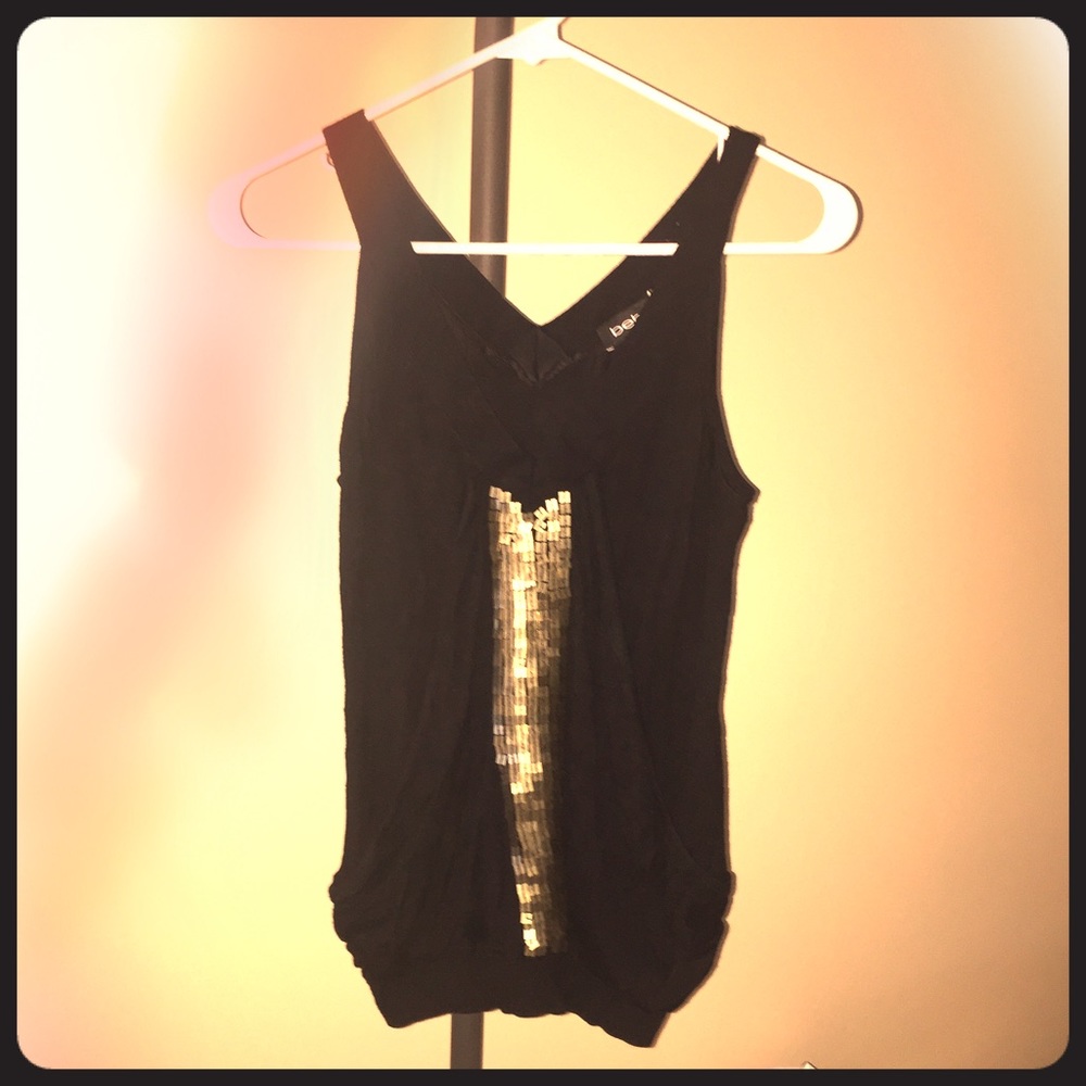Sleeveless versatile black/gold top from Bebe