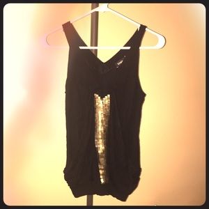 Sleeveless versatile black/gold top from Bebe