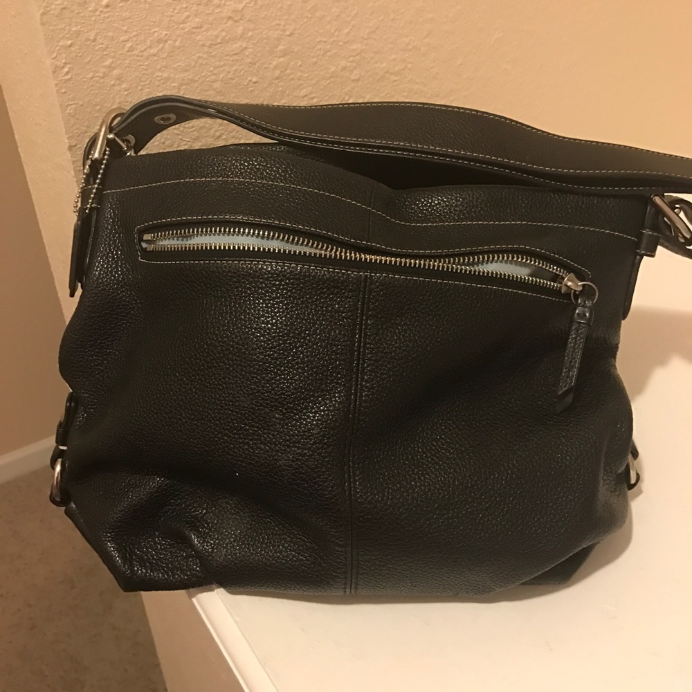 Black pebble grain Coach shoulder bag.