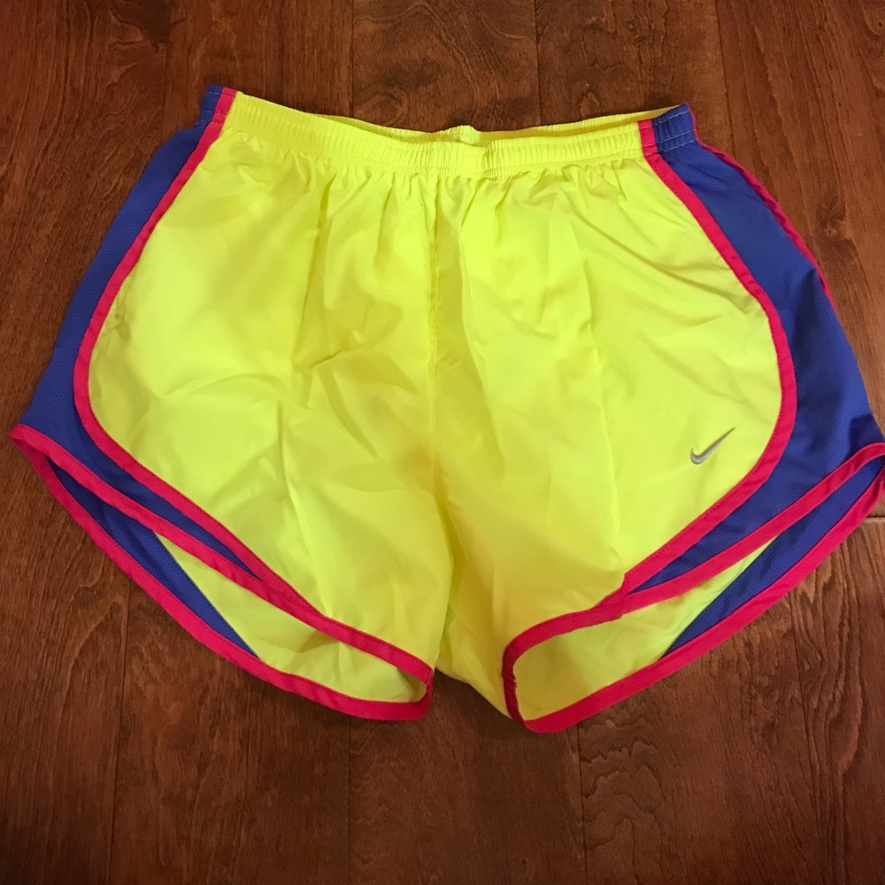 Neon yellow Nike shorts.