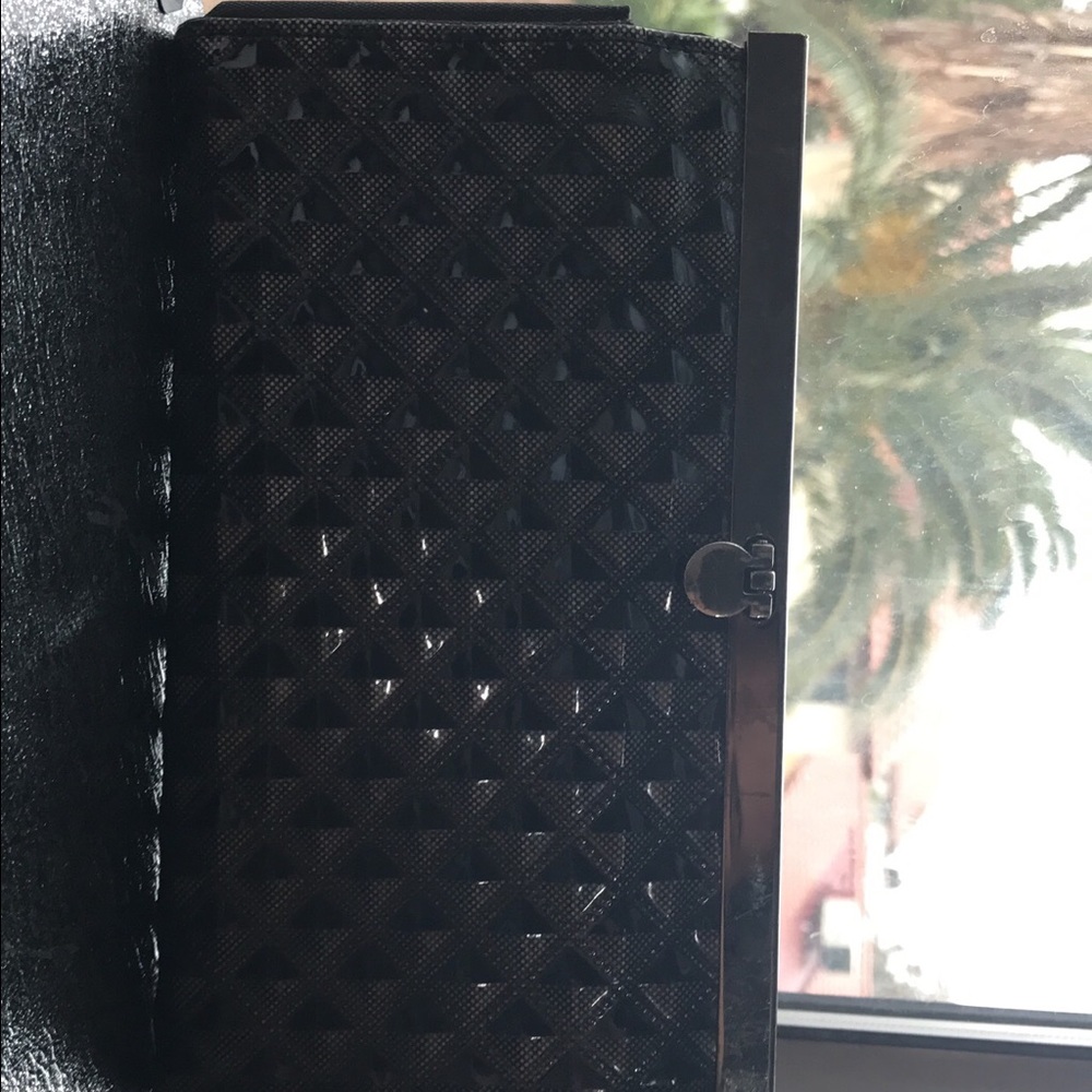 Black patterned clutch