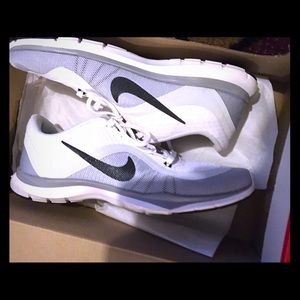White , grey, and black Nike shoes