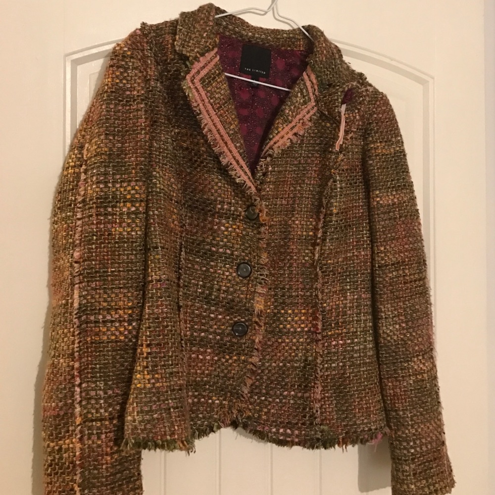 jacket has flower out of same material pinned on