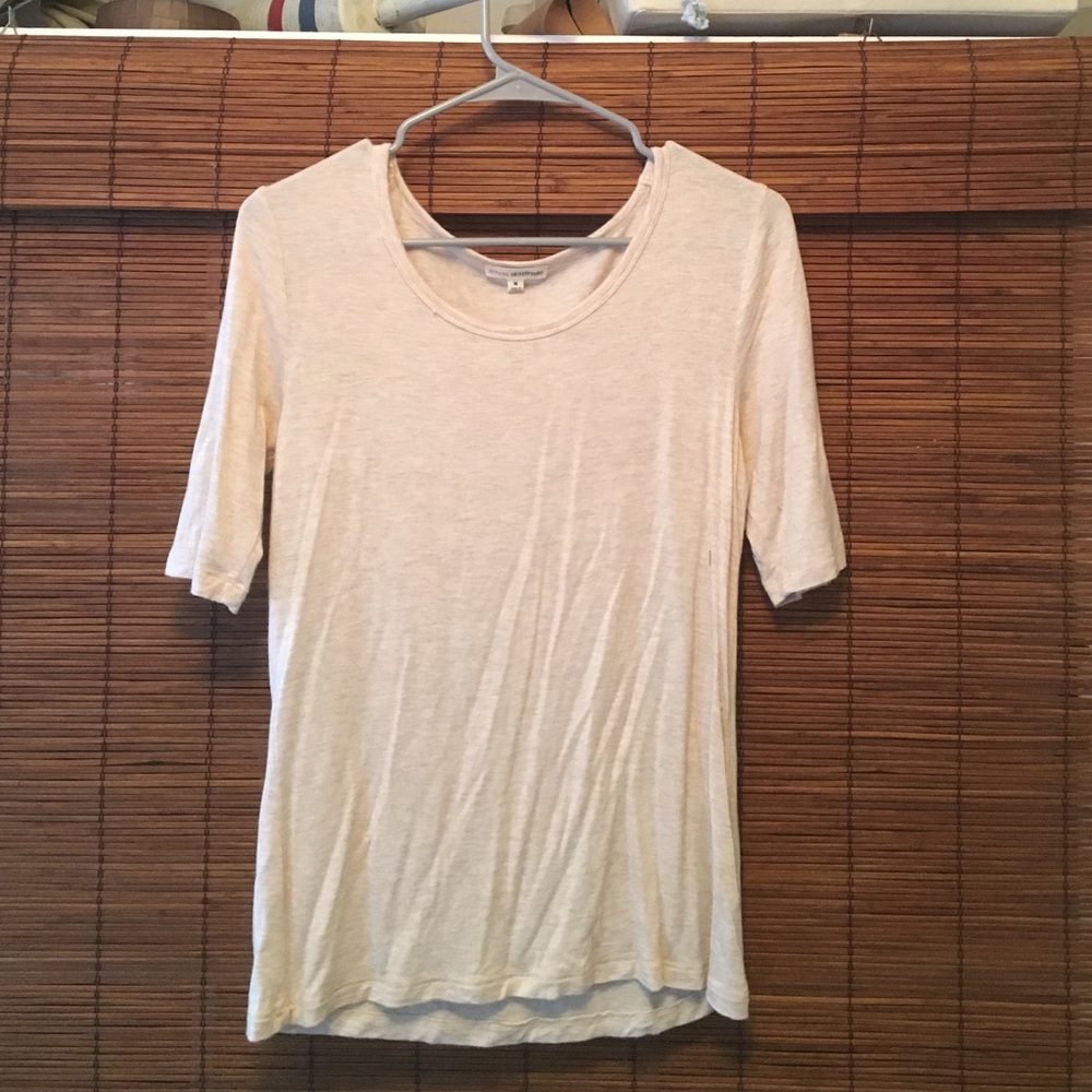 Light tan 3/4 sleeve shirt.