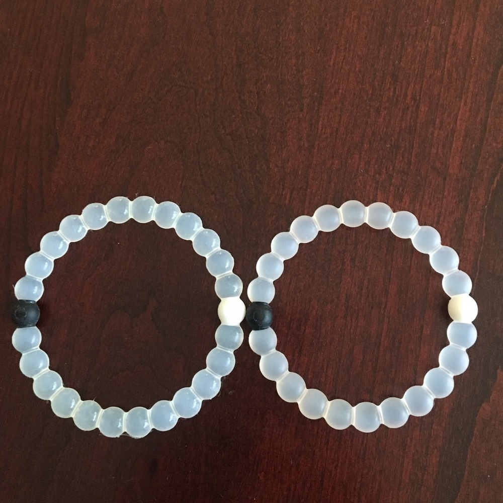 Two clear lokai bracelets