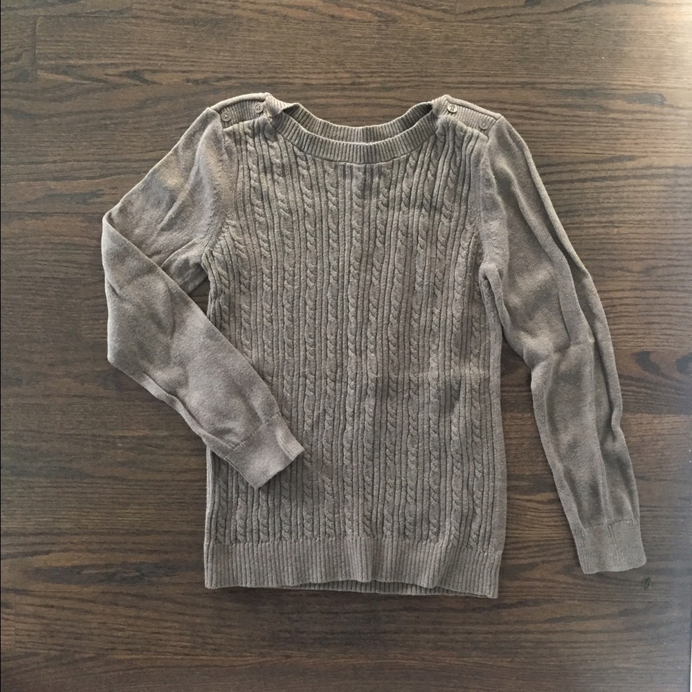 Taupe cable knit sweater with button detail.
