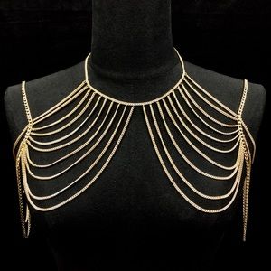 Darcy (gold chest and arm cage)