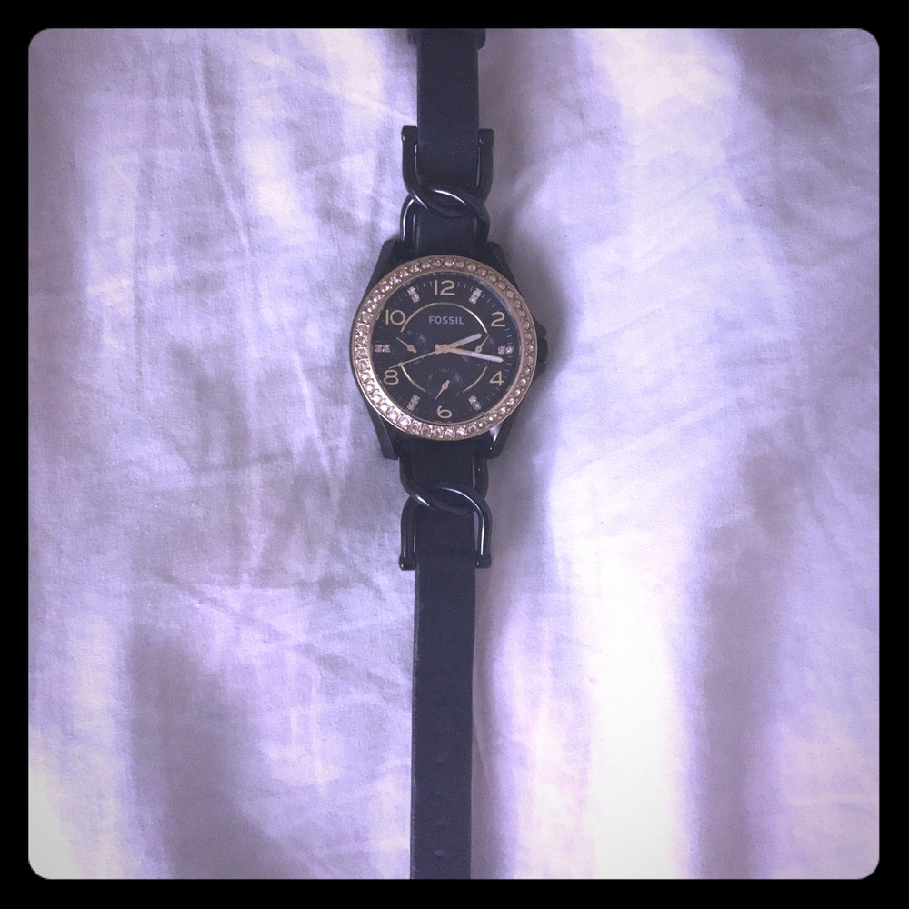 Black/gold fossil watch.