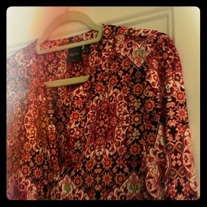 Colorful blouse runs smaller in arms