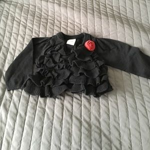 Black sweater with red rose